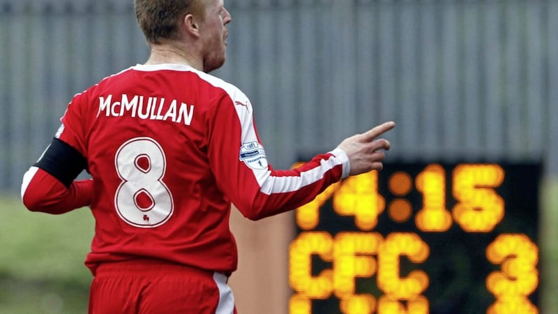 George McMullan celebrates a goal against Linfield during his 15-year career at Cliftonville 
