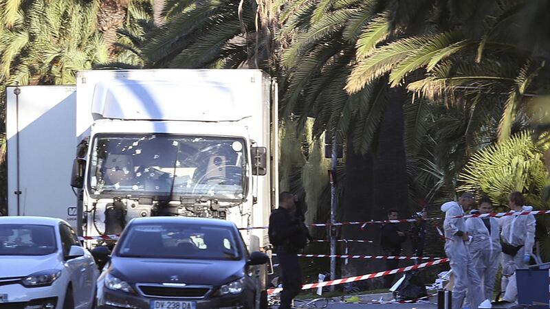 The truck which slammed into revelers late Thursday, July 14, is seen near the site of an attack in the French resort city of Nice, southern France, Friday, July 15, 2016.  France has been stunned again as a large white truck mowed through a crowd of revelers gathered for a Bastille Day fireworks display in the Riviera city of Nice. (AP Photo/Luca Bruno)&nbsp;