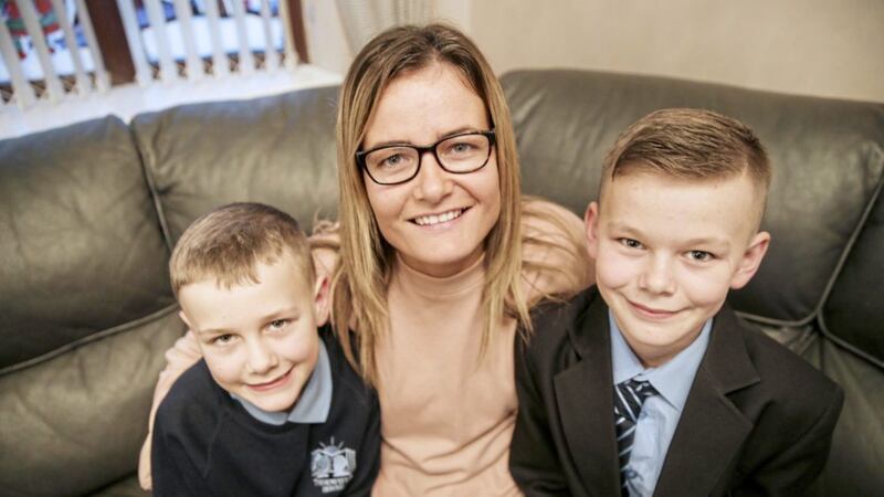 Kirsty Beggs with sons Robert (11), pictured right, and Zach (8). Both boys are being supported with language difficulties at Thornfield House School in Newtownabbey. Picture by Hugh Russell 