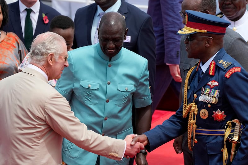 General Ogolla, right, with the King, left, and Kenya’s president William Ruto, centre, during a military ceremony in Mombasa in November 2023 (Brian Inganga/AP)