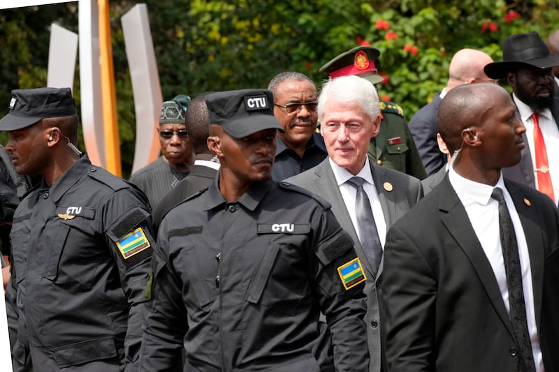 Bill Clinton, who was US president at the time of the genocide, led a delegation of foreign visitors (Brian Inganga/AP)