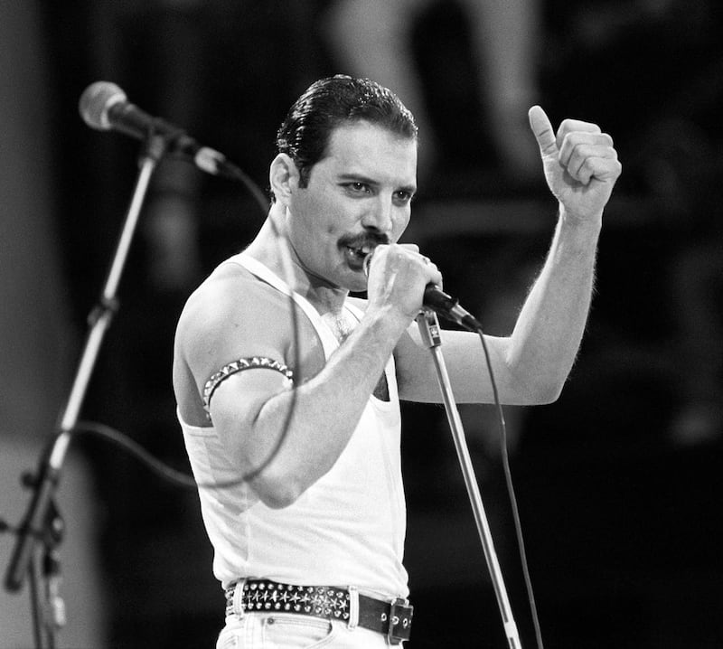 Freddie Mercury performing on stage during the Live Aid concert in 1985 