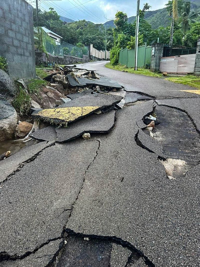 Cracks along a road in the aftermath of a massive explosion on Mahe, Seychelles 