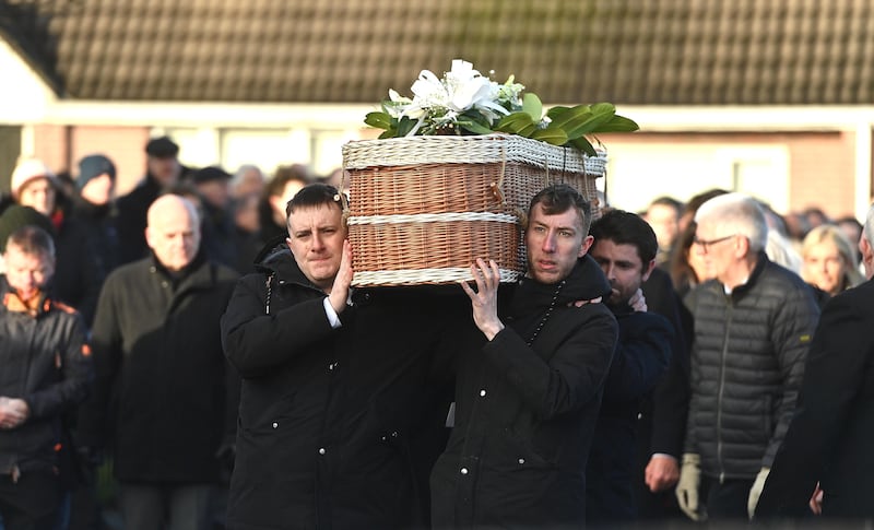 Friends carry the casket of murder victim Natalie McNally following her funeral service at her parents home in Lurgan