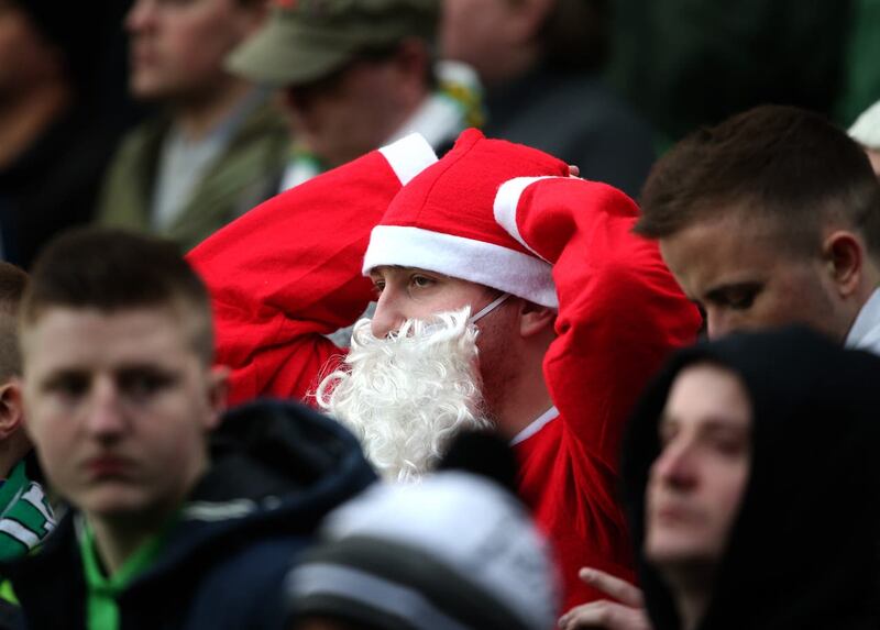 A football fan dressed as Santa
