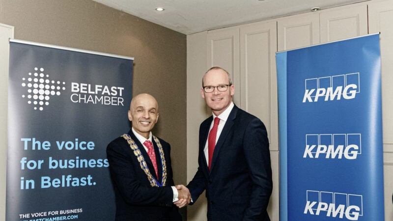 President of Belfast Chamber Rajesh Rana with T&aacute;naiste Simon Coveney in Belfast yesterday 