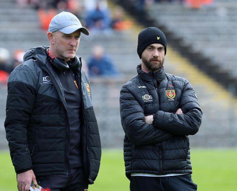 Down's Ciaran Meehan and Conor Laverty talk tactics at the start of Saturday's semi-final. Pic Philip Walsh