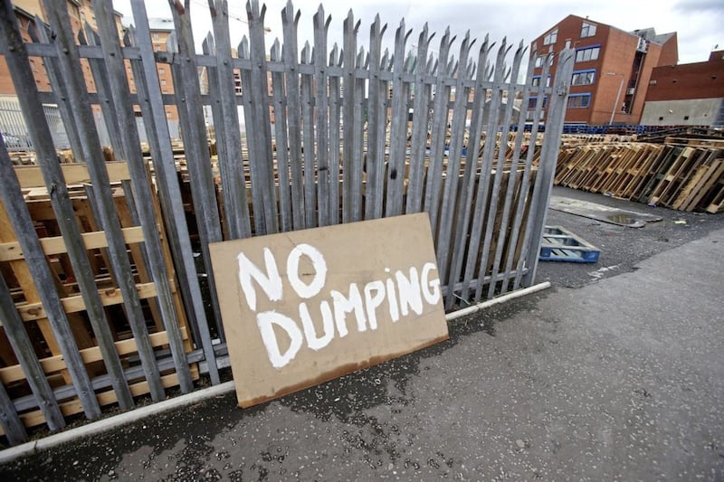 Signs warn of &#39;no dumping&#39; on land where bonfire material is being gathered in Wellwood Street in the Sandy Row area. Picture by Mal McCann 