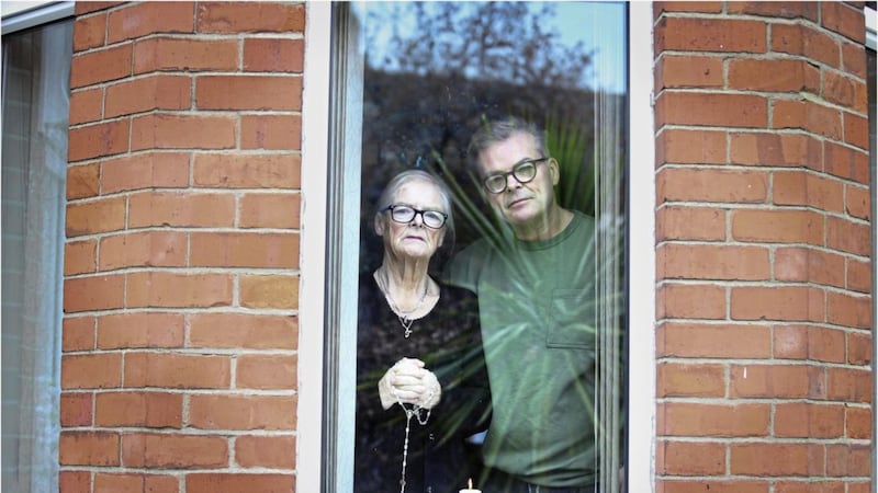 Gerry Walls and his mum Teresa live stream rosary every night from their north Belfast home. Picture by Hugh Russell 