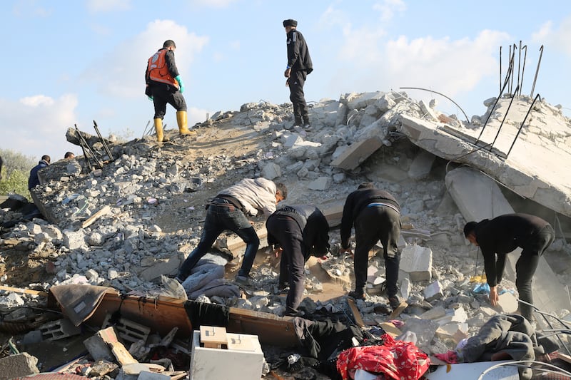 Palestinians search for survivors in Rafah (Hatem Ali/AP)