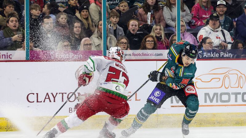 Kohei Sato of the Belfast Giants attempts to get away from Evan Mossey of the Cardiff Devils during Saturday night's game at the SSE Arena              PICTURE: William Cherry/Presseye