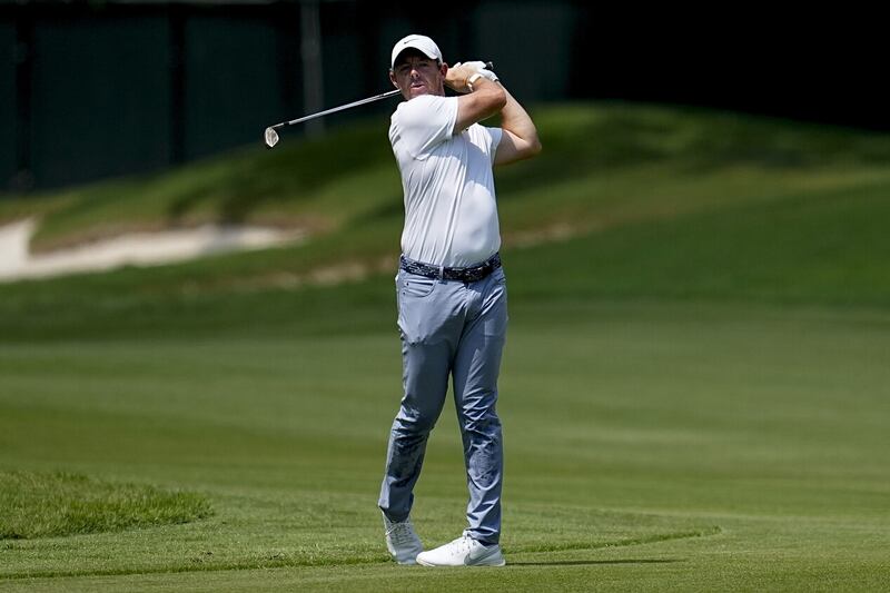 Rory McIlroy hits from the first fairway during the final round of the Tour Championship (Mike Stewart/AP)