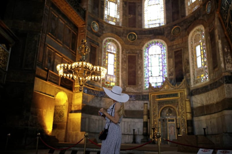 A woman visits Hagia Sophia, a former cathedral-turned-mosque which has served as a museum since 1934. A controversial court ruling means it is being turned back into a mosque. Picture by AP Photo/Emrah Gurel 