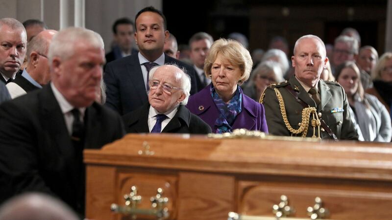 President Michael D Higgins, his wife Sabina and Taoiseach Leo Varadkar, watch as the coffin of Gay Byrne, is carried into St Mary's Pro-Cathedral in Dublin for his funeral service. Picture by Brian Lawless/PA Wire