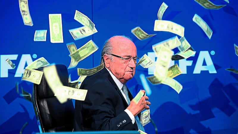 &nbsp;<b>&lsquo;HERE YOU GO, SEPP&rsquo;:</b> Fifa president Sepp Blatter is showered with bank notes thrown by comedian Simon Brodkin<div>&nbsp;</div>