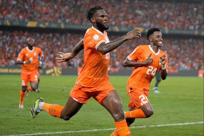 Franck Kessie celebrates scoring Ivory Coast’s equaliser en route to a 2-1 win over Nigeria in the African Cup of Nations final (Themba Hadebe/AP)