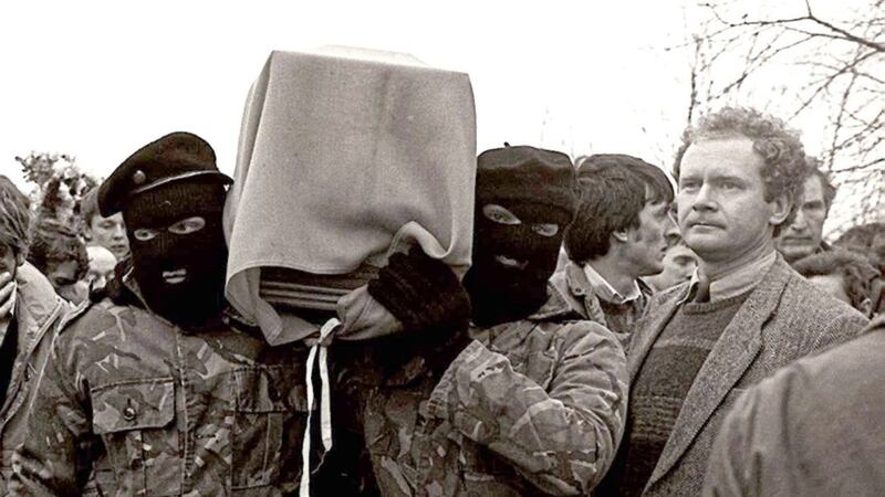 Sinn F&eacute;in vice President Martin McGuinness pictured with masked IRA men at the funeral of Brendan Burns in 1988. Picture by Paul Faith 