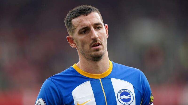 Brighton captain Lewis Dunk is a doubt for the visit of Manchester City (Tim Goode/PA)