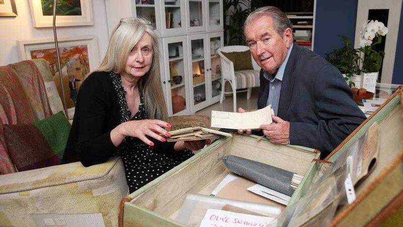 Marie Claire Douglas and Denis Tuohy look through the artefacts belonging to a Newry First World War nurse that are the focus of a play being staged at the Ulster Museum Picture: Mal McCann 