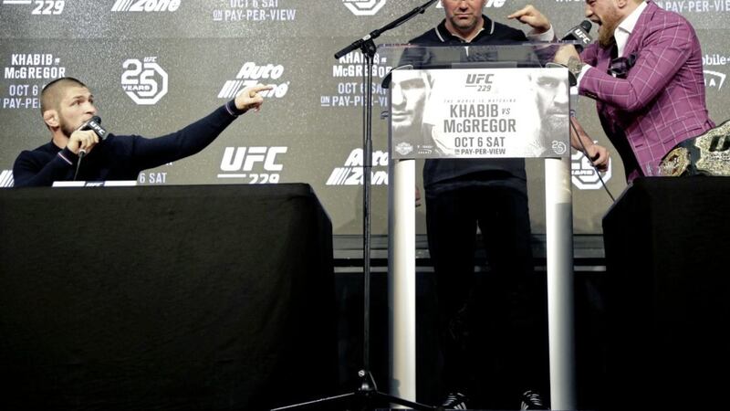 Conor McGregor (right) taunting Khabib Nurmagomedov (left), with UFC president Dana White centre during a news conference last month.