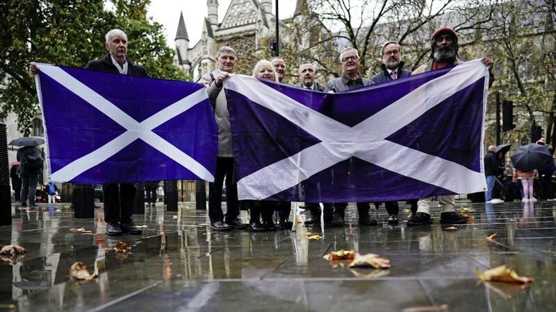 Scottish independence supporters outside the Supreme Court in London which made clear that the will of the people alone is not enough to allow a vote to take place on leaving the United Kingdom. Photo: Aaron Chown/PA Wire 
