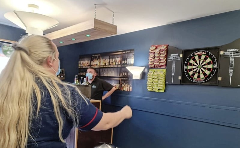 Margaret McGeown, Assistant Manager of Our Lady&#39;s Home in west Belfast, playing darts with the residents 