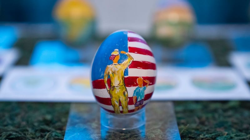 Eggs designed by children of members of the military adorn the East Colonnade of the White House ahead of the Easter egg roll (AP Photo/Evan Vucci)