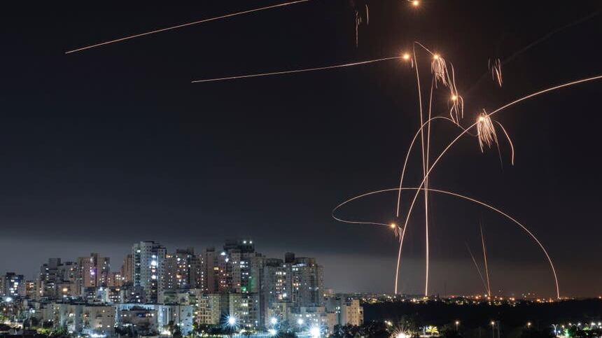 Israel’s Iron Dome missile defence system fires interceptors at rockets (Tsafrir Abayov/AP)
