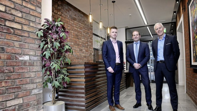 Pictured at the redeveloped Flax House are Jonathan Elder, corporate banking manager at Danske Bank (centre) with Gareth Booth (left) and Neil McKibbin (right), directors of Straidorn Properties 