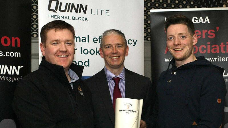 Quinn Building Products area manager Terry Fay (left) and UGAAWA chairman John Martin (centre) present Conor McManus with his monthly award. 