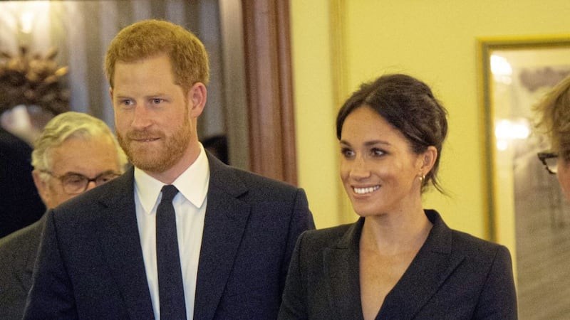 Duchess of Sussex Meghan Markle wears a black double-breasted tuxedo dress by Canadian brand Judith &amp; Charles at a charity event in London with Prince Harry 