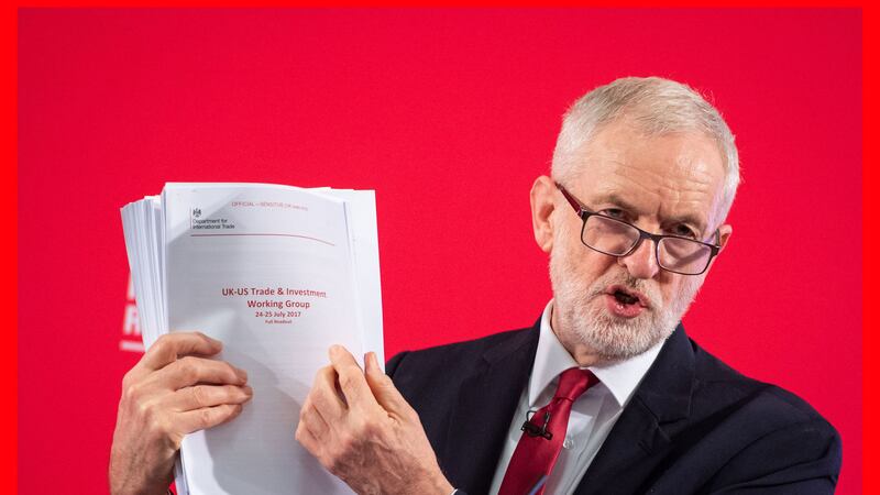 Labour leader Jeremy Corbyn holds an unredacted copy of the Department for International Trade's UK-US Trade and Investment Working Group report following a speech about the NHS, in Westminster, London. Picture by Dominic Lipinski/PA Wire&nbsp;
