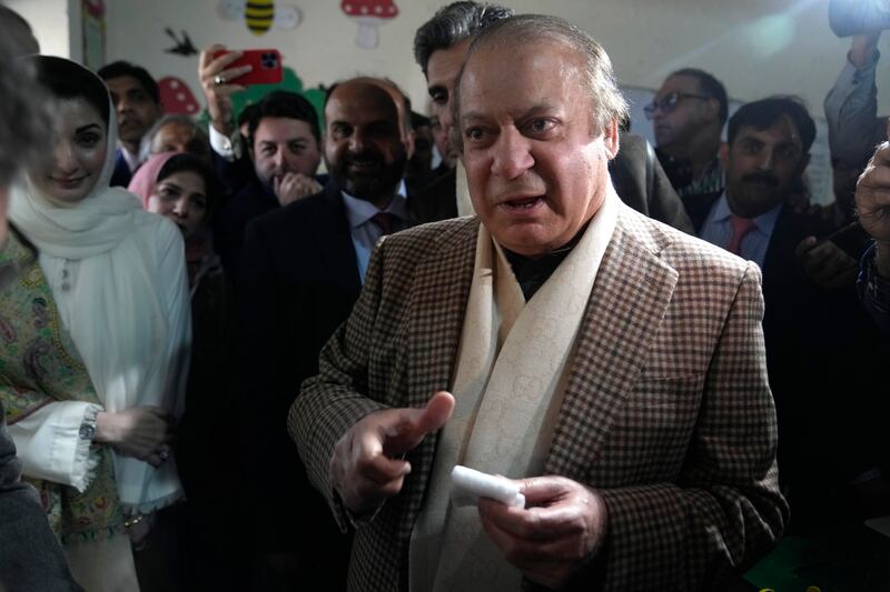 Pakistan’s former prime minister Nawaz Sharif arrives to cast his vote at a polling station for the country’s parliamentary elections, in Lahore, Pakistan (KM Chaudary/AP)