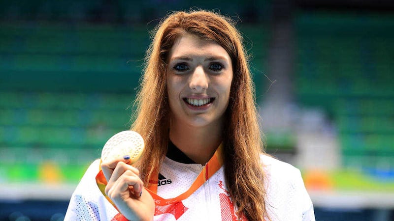 Bethany Firth with her Gold medal at the Olympic Aquatics Stadium. Picture by Adam Davy/PA 