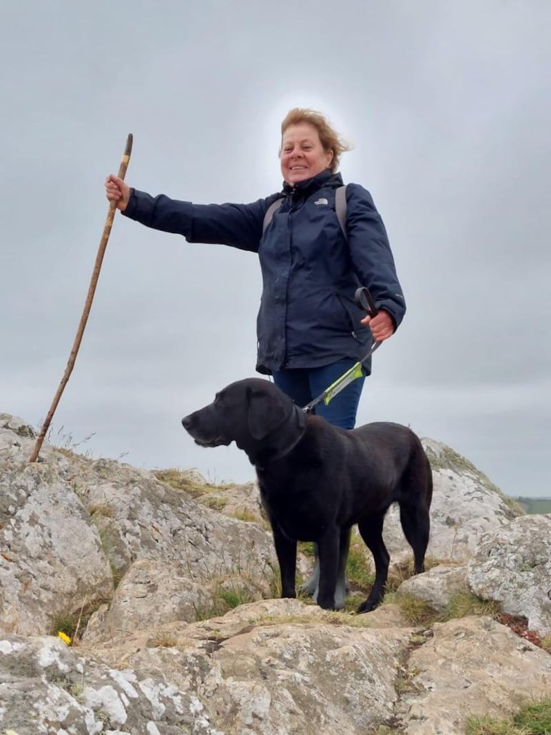 Tiggi Trethowan with her guide dog black Labrador Jackie