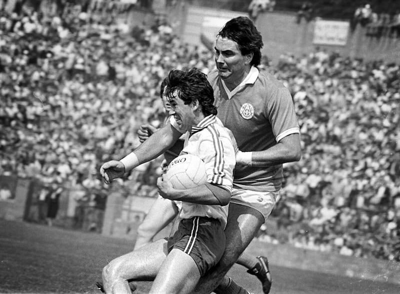 Eugene McKenna in action for Tyrone against Armagh player and future manager Joe Kernan 