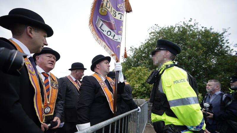 Orange Order members at a barrier during the Drumcree parade in Portadown, Co Armagh (Niall Carson/PA)