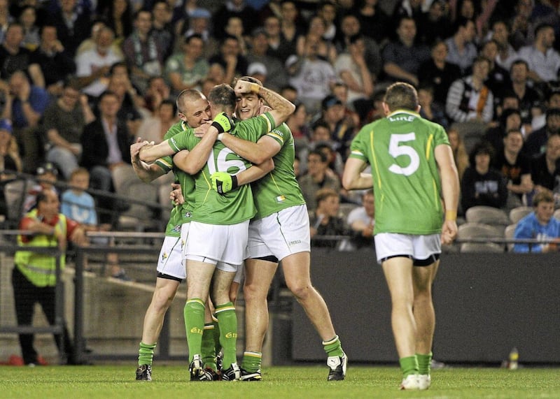  Ireland's Steven McDonnell (16) celebrates after scoring his sid's goal with team-mates Kieran Donaghy (left) and Michael Murphy during the 2011 International Rules 1st Test Australia v Ireland Etihad Stadium Melbourne Australia. Picture: Ray McManus / SPORTSFILE 