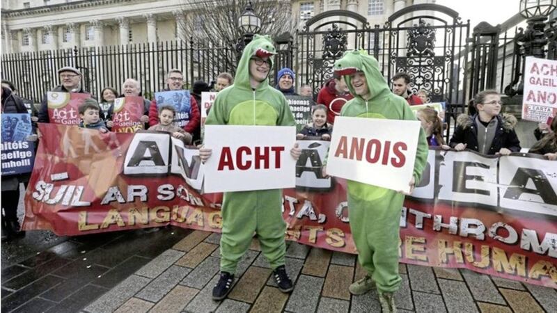 Irish language campaigners demonstrate at the High Court in Belfast last month as a Judicial Review got underway. Picture by Hugh Russell. 
