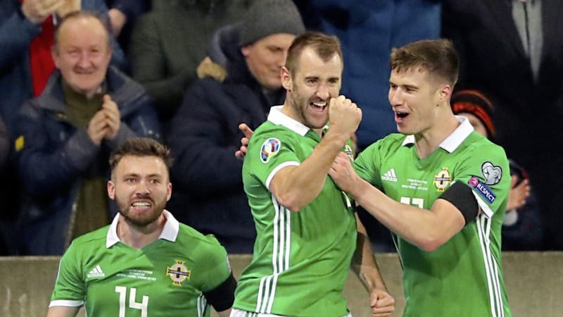 Northern Ireland&#39;s Niall McGinn (centre) celebrates scoring his side&#39;s first goal. Picture by Niall Carson/PA Wire 
