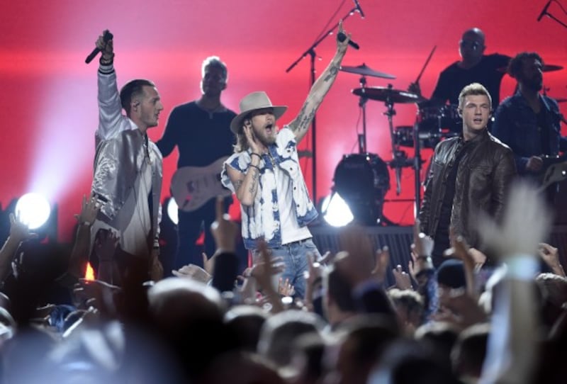 Nick Carter performs with Tyler Hubbard and Brian Kelley, of Florida Georgia Line (Photo by Chris Pizzello/Invision/AP)