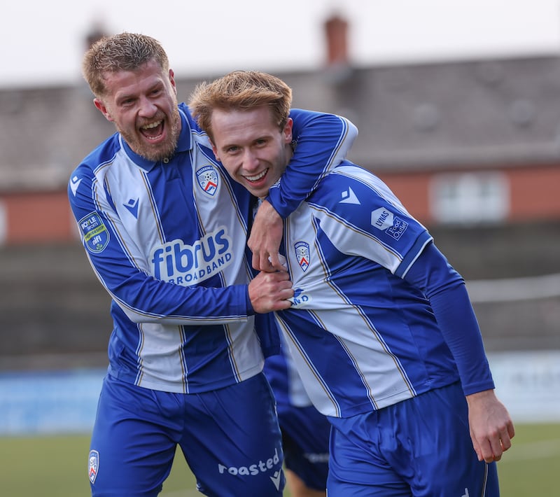 Adam Brooks (right) celebrates with Lyndon Kane after making it 5-0 against his former club Crusaders at Seaview
