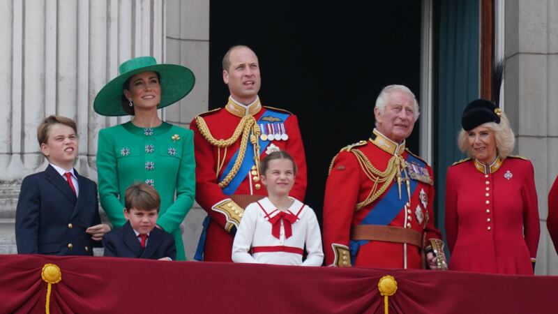 From left: Prince George, the Princess of Wales, Prince Louis, the Prince of Wales, Princess Charlotte, King Charles III and Queen Camilla on the balcony of Buckingham Palace (PA)