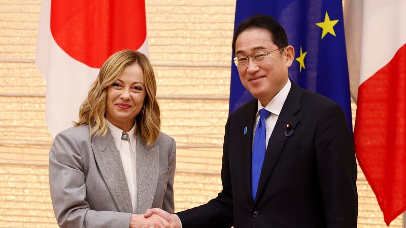 Italian Prime Minister Giorgia Meloni and her Japanese counterpart Fumio Kishida pose for the cameras during a Japan-Italy bilateral meeting at Japan’s prime minister office in Tokyo on Monday (Rodrigo Reyes Marin, Pool via AP)