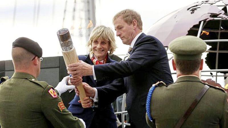US ambassador Jean Kennedy-Smith delivering the eternal flame from JFK&#39;s grave with then-Taoiseach Enda Kenny in New Ross Co Wexford 
