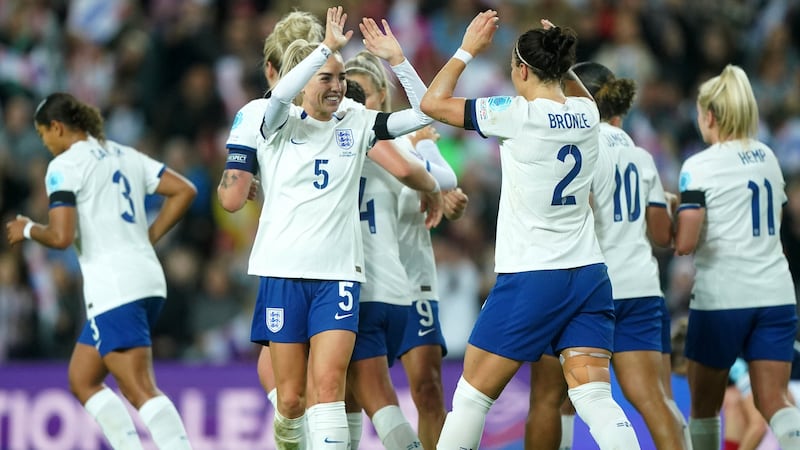 Lucy Bronze, centre right, celebrates her goal against Scotland with Alex Greenwood (Owen Humphreys/PA)