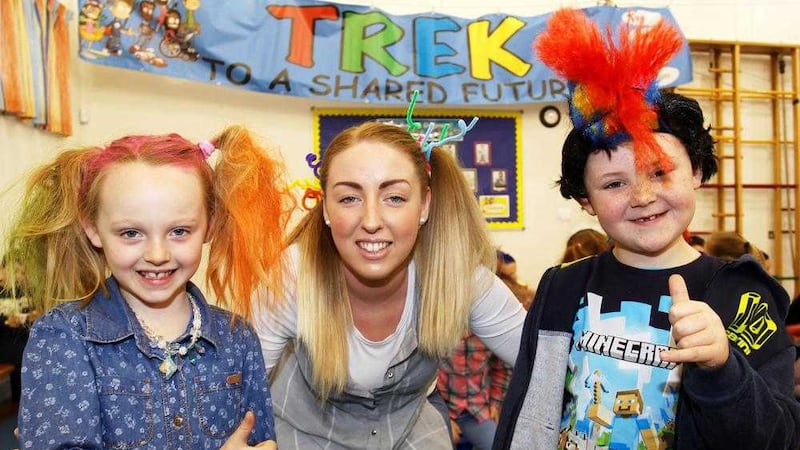 Lowwood PS teacher Janine McCluskey with pupils Lily and Liam at the Wacky Hair Day, part of the Trek initiative 