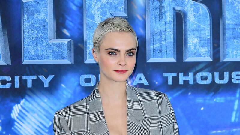 She has thrown herself into launching an acting career, but Cara Delevingne will still make the odd turn on the catwalk.
