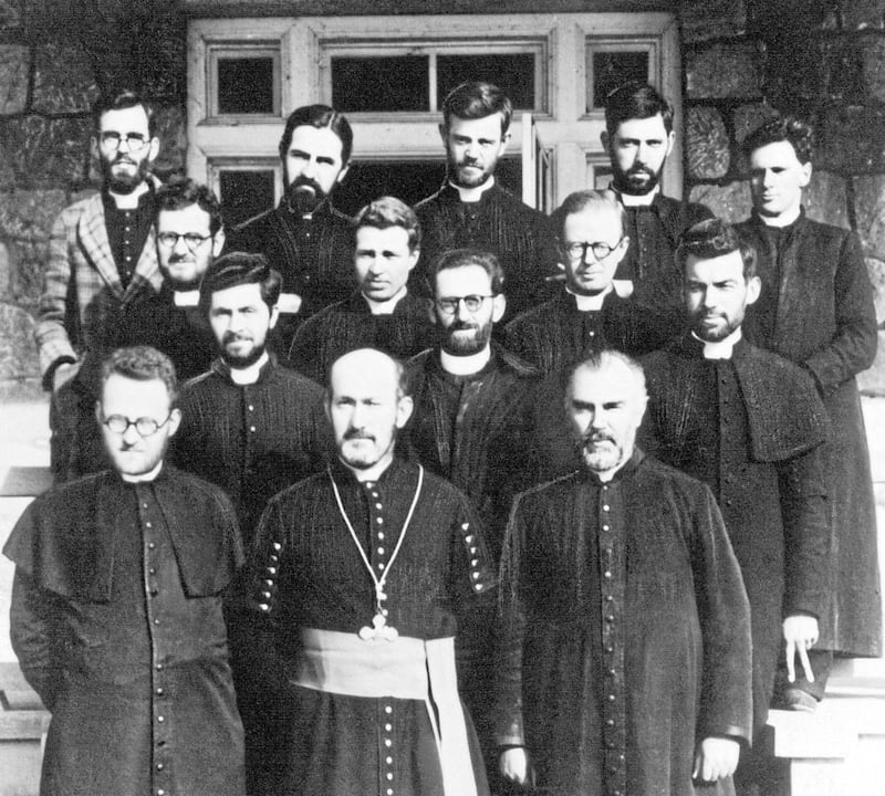Co Down priest Fr James Maginn was one of seven Columbans killed for their faith by North Korean Communists in 1950. In this 1942 photograph he is pictured with 13 other Columbans during their internment by the Japanese forces who occupied Korea during the Second World War.  Pictured in the front row are Brian Geraghty, Thomas Quinlan and Pat Brennan; in the second row, James Maginn, Frank McGann and, giving the victory sign, Tony Collier; in the third row, Pat McGowan, Phil Crosbie, Tom Neligan; in the back row, Paddy Deery, Frank Herlihy, James Doyle, Frank Gallagher and Hubert Hayward. As well as Fr Maginn, Fr Pat Brennan and Fr Tony Collier were also killed by North Korean communist forces. Picture courtesy of Missionary Society of St Columban. 