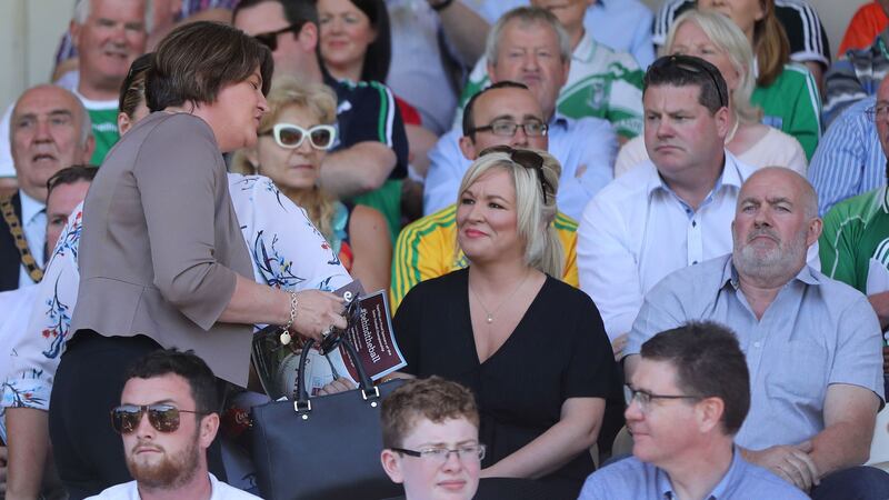 Arlene Foster with Sinn F&eacute;in deputy Michelle O'Neill at the GAA Ulster final